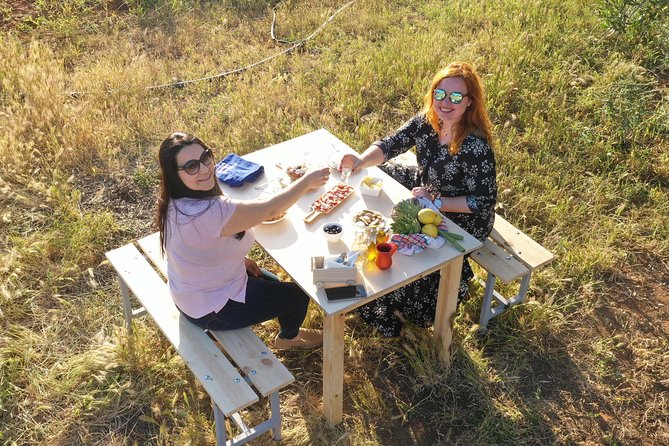 Cretan Farm Tour with Cheese-Making, Olive Oil Tasting & Picnic - Beneath the wooden roof with Mama Stela