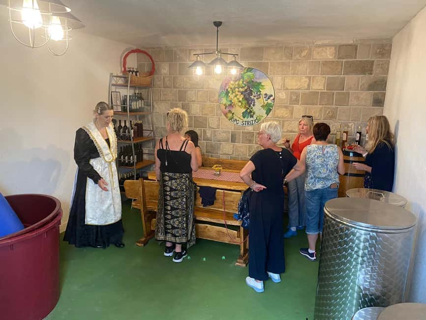 Kastela: Wine & Olive Tasting Tour w/Delicacies & Live Music - A Dalmatian table under the pergola