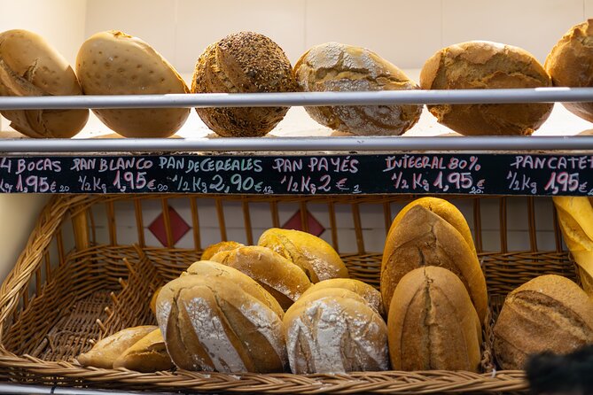 Malaga Food Tour with 12+ Tastings: Tapas, Olive Oil, Ham & More - Roman Malaga and the Alcazaba views