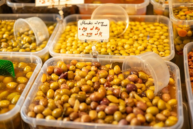 Malaga Food Tour with 12+ Tastings: Tapas, Olive Oil, Ham & More - One hour inside Atarazanas Market