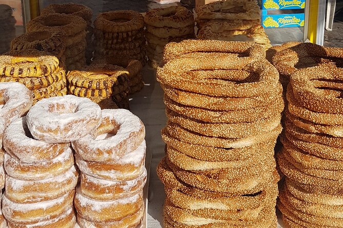 Traditional breakfast in markets with olive oil and honey tasting - Spinach pie, sesame bread, yogurt, and honey